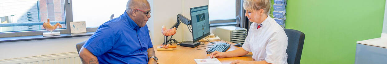 man is sitting at doctor's table